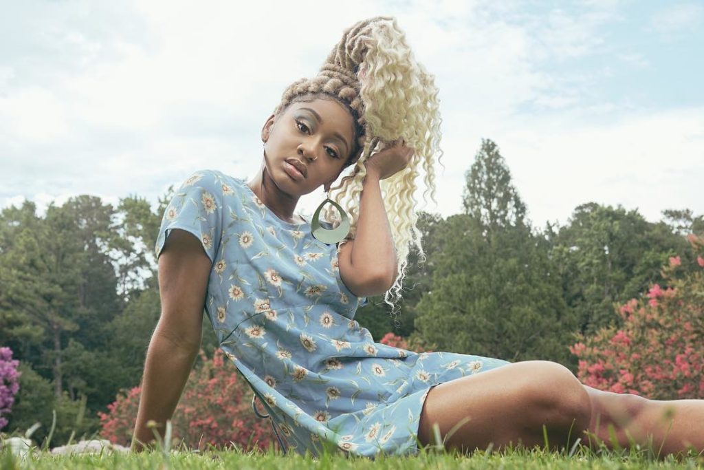 Blonde Faux Locs Updo With Curly Ends